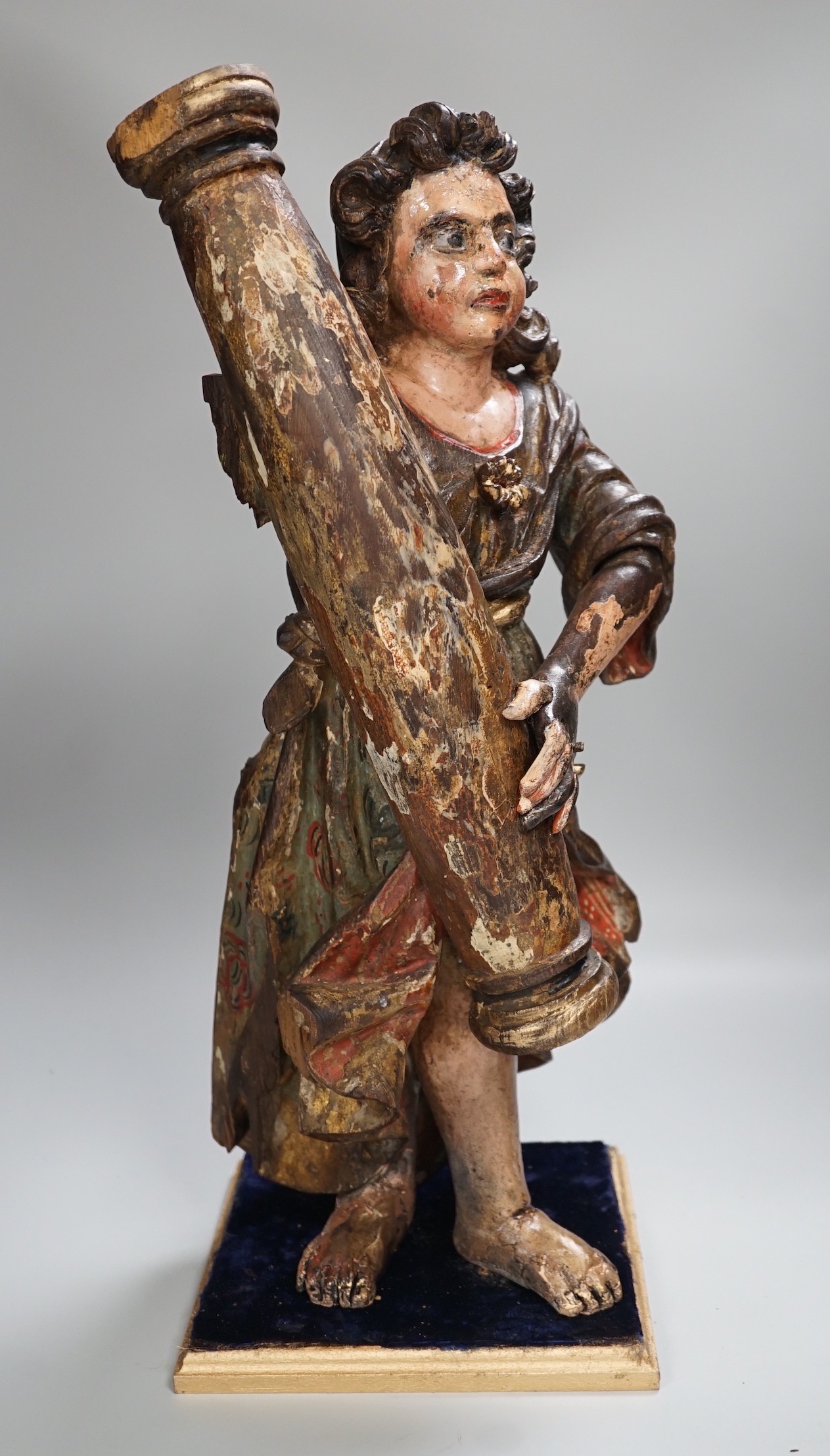 A carved wood polychrome model of a Saint, 53cm